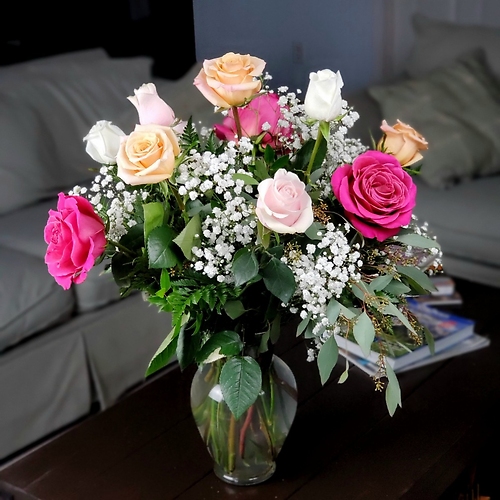 A Dozen Long Stemmed Assorted Roses in a Vase